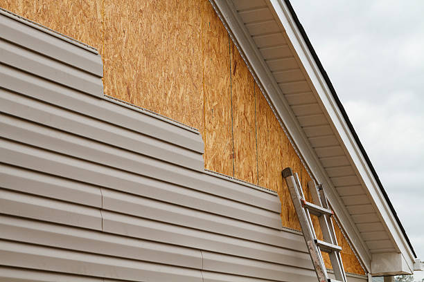 Professional Emergency Siding Repair technician working in Lowell, MA